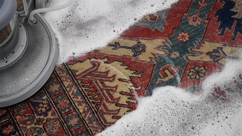 Close-up of rug cleaning foam treatment