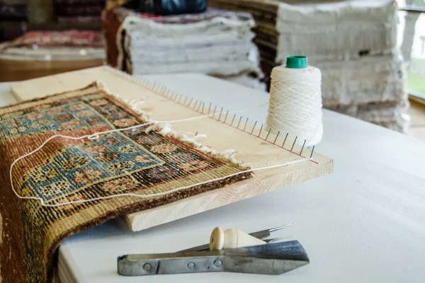 Rug repair and restoration on a loom